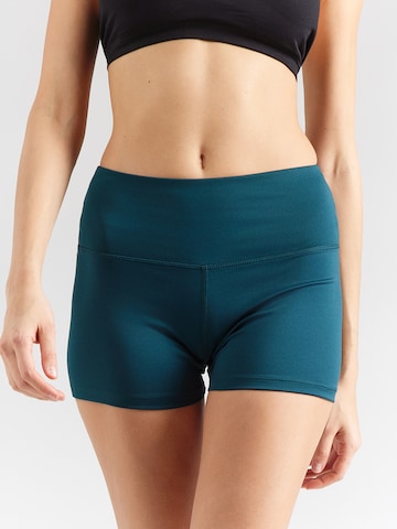 Skinny Pantaloni sportivi 'ID TRAIN' di Reebok in verde: frontale