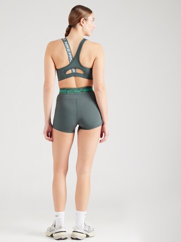 NIKE Skinny Sports trousers in Green
