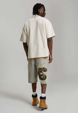 Ed Hardy Широка кройка Дънки в синьо