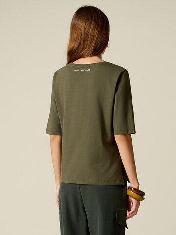 Maglietta di oltre in verde