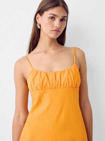 Bershka Letné šaty - Oranžová