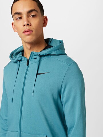 NIKE Sportsweatjacke in Grün