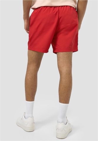 Regular Pantaloni de la Karl Kani pe roșu