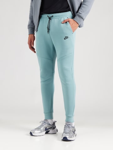 Effilé Pantalon 'TCH FLC' Nike Sportswear en vert : devant