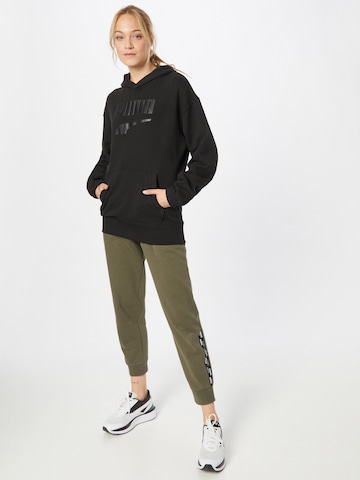 PUMA Sweatshirt 'PUMAxABOUT YOU' in Schwarz