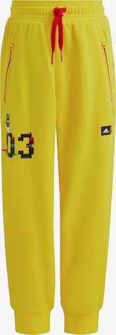 ADIDAS SPORTSWEAR Tapered Workout Pants 'LEGO' in Yellow: front