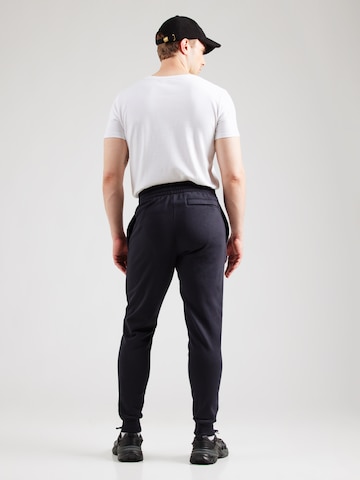 UNDER ARMOUR Tapered Workout Pants in Black