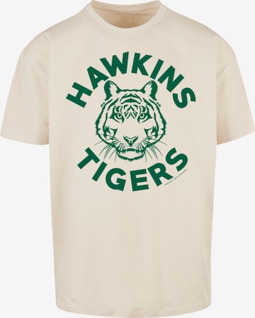 F4NT4STIC Shirt 'Stranger Things Hawkins Tigers Netflix TV Series' in Beige: voorkant