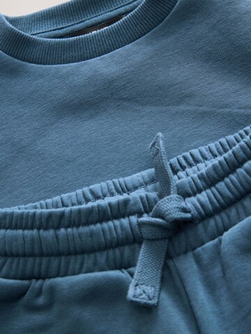 Set Next en bleu