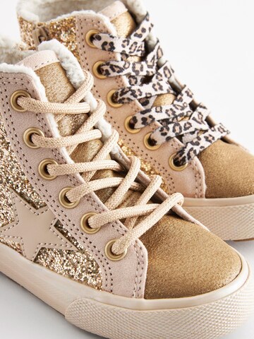 Baskets Next en or