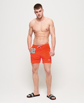 Superdry Plavecké šortky 'Water' – oranžová