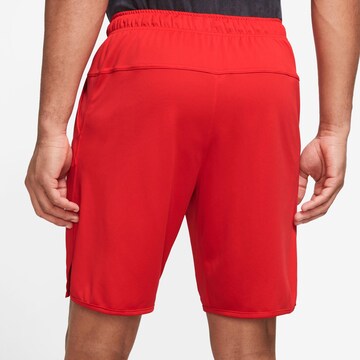 NIKE Regular Workout Pants 'Totality' in Red