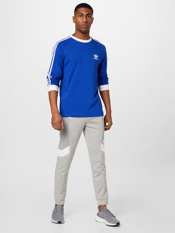 ADIDAS SPORTSWEAR - Tapered Calças de desporto 'Essentials Colorblock' em cinzento