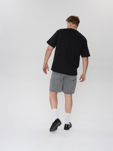 Maglia trikot 'Galal' di Dxnmxrk in nero