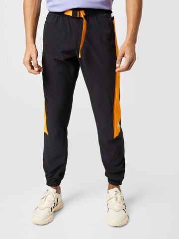 ADIDAS SPORTSWEAR Tapered Workout Pants 'Travel Vent' in Black: front