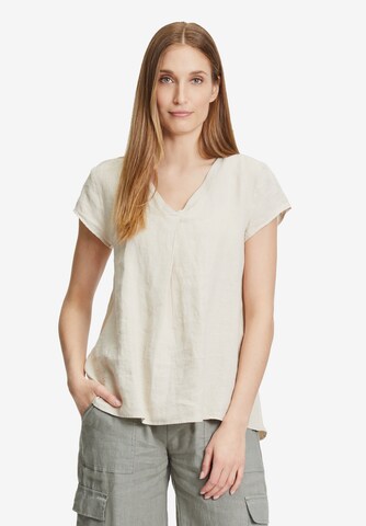 Cartoon Blus i beige: framsida