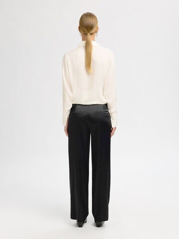 Wide leg Pantaloni con pieghe di SELECTED in nero