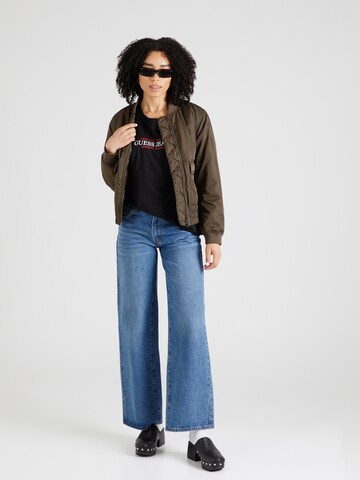 Maglietta di GUESS JEANS in nero