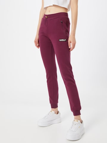 ELLESSE Tapered Trousers in Purple: front
