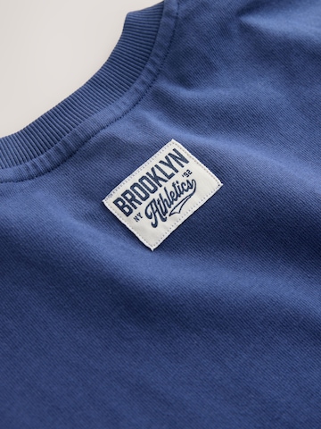 T-Shirt Next en bleu