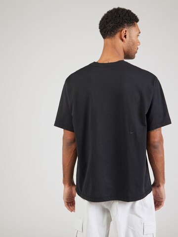 T-Shirt fonctionnel 'HERITAGE' NIKE en noir