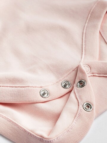 Next - Pijama entero/body en rosa
