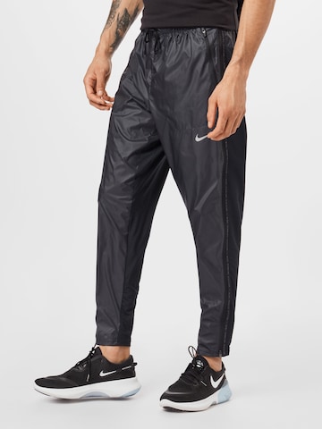 NIKE Regular Workout Pants 'Phenom' in Black: front