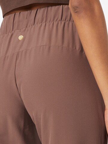 Tapered Pantaloni sportivi 'Austberg' di Athlecia in marrone