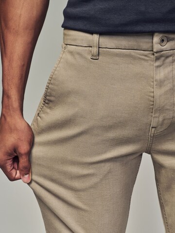 Slimfit Pantaloni chino di Next in beige