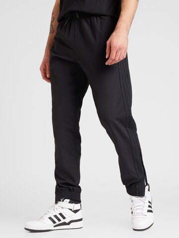 ADIDAS ORIGINALS Tapered Pants in Black: front