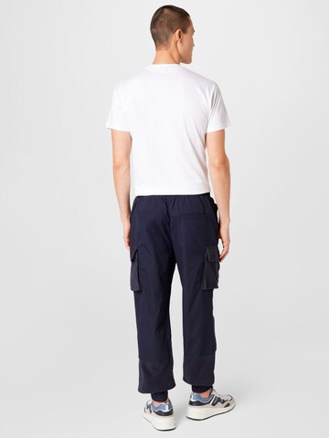 Tapered Pantaloni cargo di Mennace in blu