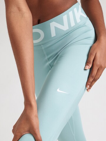 NIKE Skinny Sportbroek in Groen