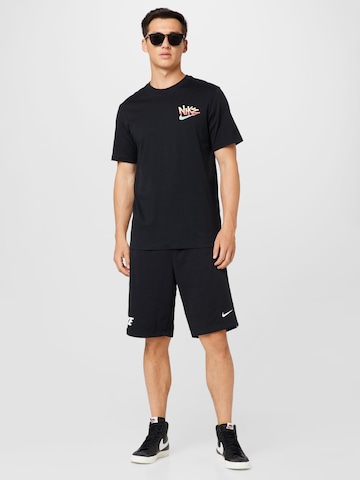 Nike Sportswear Ohlapna forma Hlače 'Repeat' | črna barva