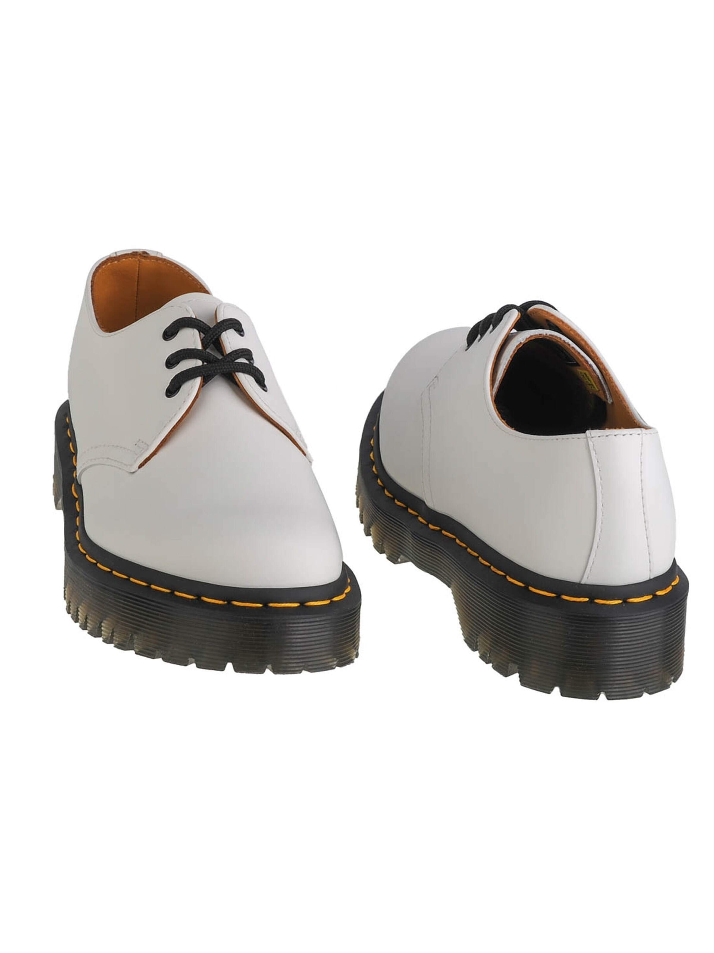 Dr. Martens Slip-Ons in White