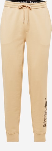 Calvin Klein Jeans Normalny Spodnie w kolorze beżowy: przód