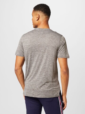 PUMA Sportshirt  'TRAIN FAV' in Grau