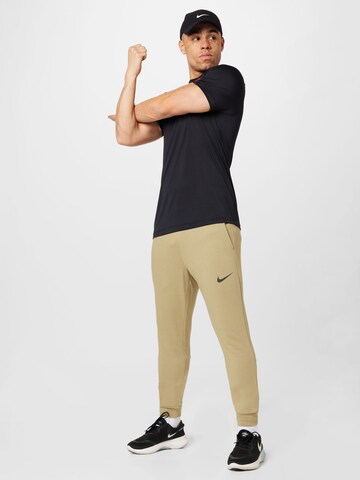 NIKE Tapered Sportbyxa i beige