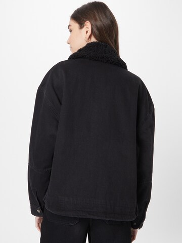 LEVI'S ® Övergångsjacka 'Bubble Sherpa Trucker Jacket' i svart