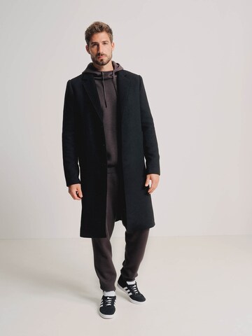 ABOUT YOU x Kevin Trapp Between-Seasons Coat 'Julian' in Black