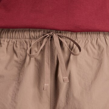 new balance Loosefit Cargobroek 'Woven Cargo Pant' in Bruin