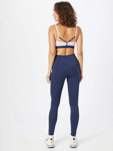 NIKE Skinny Sportbroek in Blauw