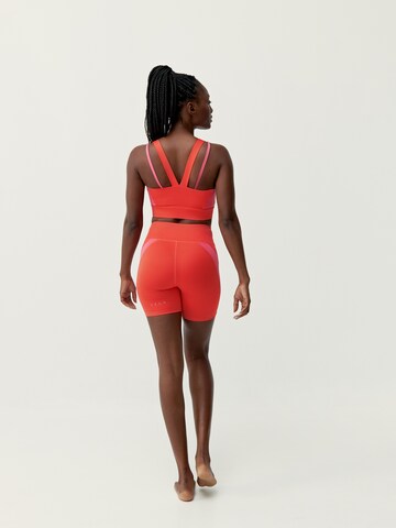 Skinny Pantalon de sport 'Latika' Born Living Yoga en orange