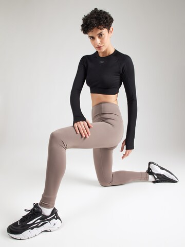 Skinny Pantalon de sport 'FLOAT' Girlfriend Collective en marron