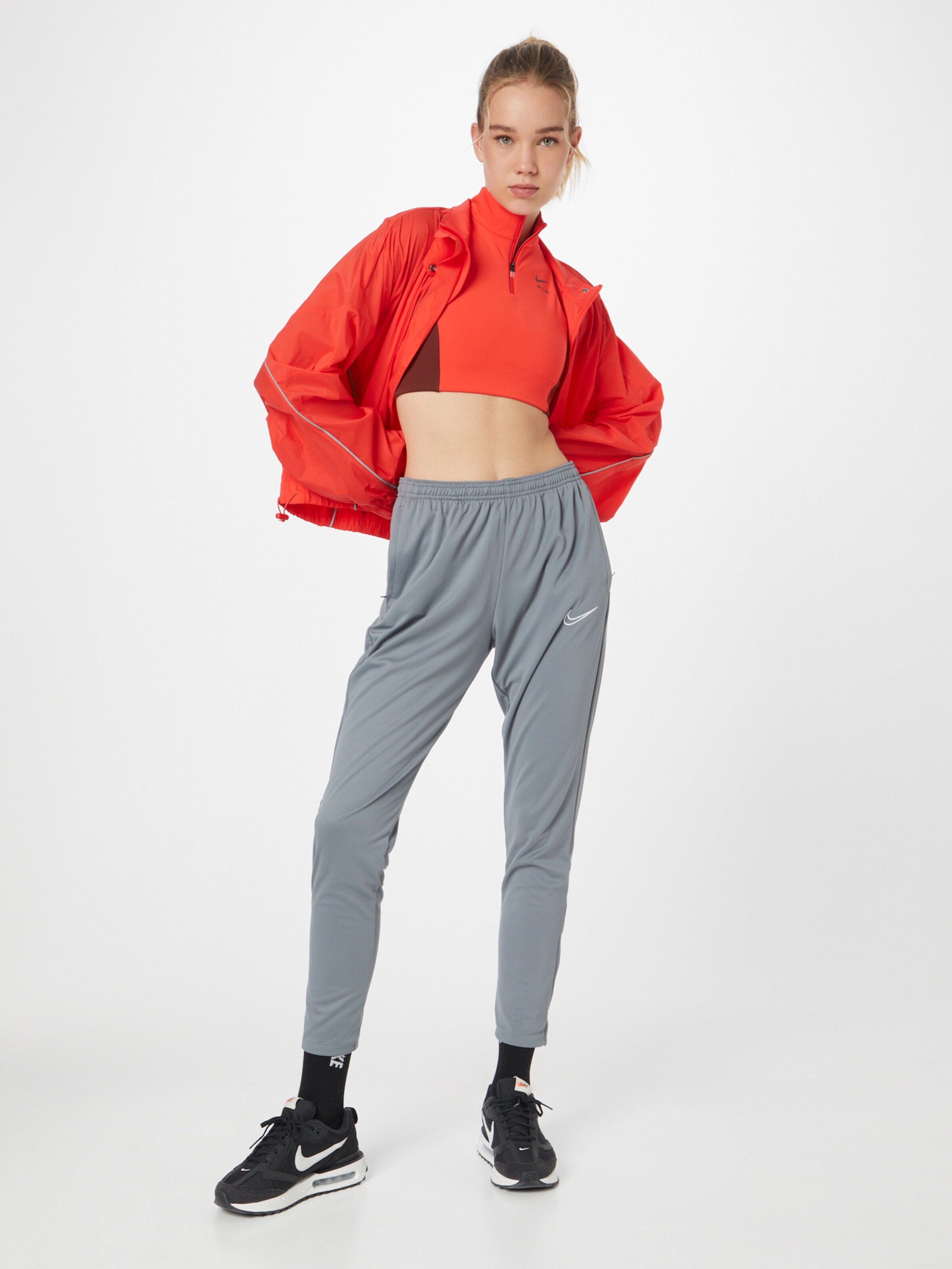 NIKE Bralette Sports bra in Burgundy Orange Red ABOUT YOU