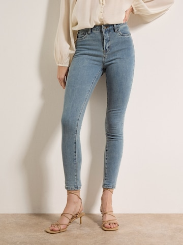 Skinny Jean Apricot en vert