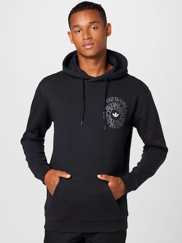 ADIDAS ORIGINALSSweater majica 'Graphic Ozworld' - crna boja: prednji dio
