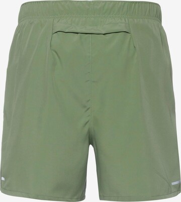 NIKE Regular Workout Pants in Green