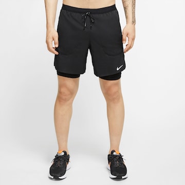 NIKE Regular Workout Pants 'Flex Stride' in Black: front