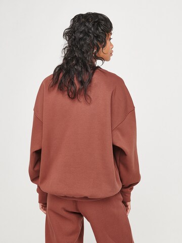 ABOUT YOU x VIAM Studio Sweatshirt 'Motivation' in Brown: back