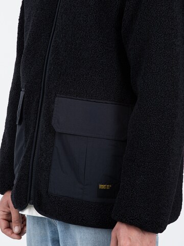 Carhartt WIP Übergangsjacke 'Devin Liner' in Schwarz
